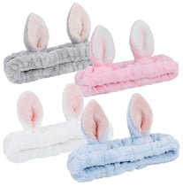 a set of four bunny ears in various colors of pink, blue and white