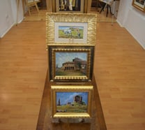 a display of paintings and paintings on display