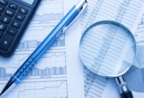 CA examining digital financial records for discrepancies and fraud.