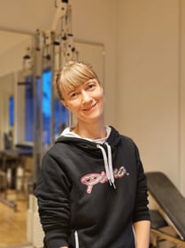 a woman in a black hoodie and a black and white hoodie