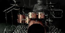 artistic picture of a man playing drums