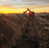100-foot-leach-field-ditch-waiting-for-gravel-less-pipe-or infiltrator-leaching-chambers-intallation