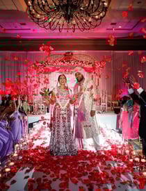 omantic mandap setup with pastel flowers and drapes by Amika Weddings and Events in Pune