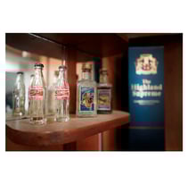 photograph of a coke bottle and a minibar