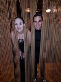 Carly and Kahn with their heads in the hanging chains at the Boom Boom Room Brisbane.