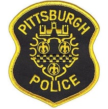 Pittsburgh Police yellow and black logo badge