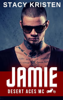 A man with tattoos on his chest and neck, wearing dark sunglasses.