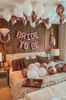 Memorable bridal surprise room with shimmering balloons and luxury “Bride to Be” decor.