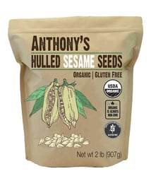 a bag of whole grained seeds on a white background