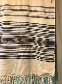 a tallit on a wall