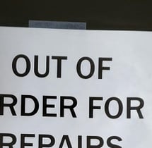 a sign that says out of order for repairs