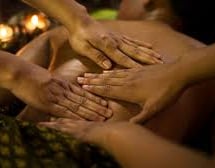 Lady getting a four hands massage
