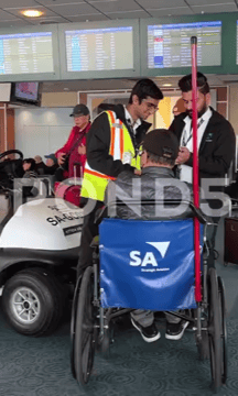A screengrab from a stock video, which shows me assisting a wheelchair guest