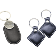 Jetons RFID en cuir de couleur noir et de formes losange et ovale pour serrure d'établissement hôtelier.