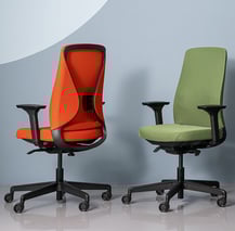 Red and green ergonomic task chairs with mesh backs and adjustable armrests