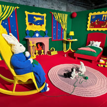 The Goodnight Moon room by Dundee & Lee artists Emilie Odeile & Ken Chapin, featuring a knit bunny in a rocking chair.