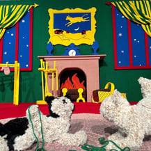 Two knit cats play with yarn on a pink crocheted rug in Goodnight Moon - A Fiber Tale by Dundee & Lee artists Odeile & Chapin