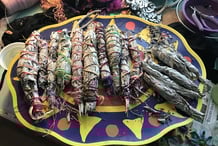 a colorful plate with a bunch of smudge sticks on it