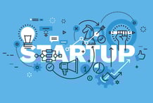 Startup team reviewing financial projections with a CA advisor.