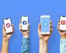 a group of people holding up their phones with social media