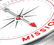 a compass with the word mission