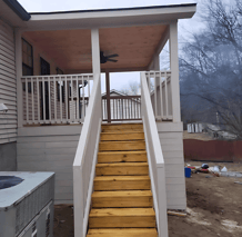 a house with a staircase deck porch nashville