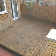 Before photo of tired, weathered wooden decking in Hull, showing dirt buildup and faded colour before restoration