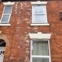 Before photo of a house brick wall in Hull showing white salt deposits and staining before professional brick cleaning