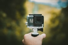 a person holding a camera and taking a picture