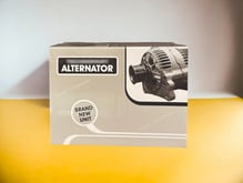 Corrugated folding carton for Alternator