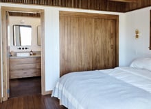 Cozy prefab modular tiny home bedroom with wood accents