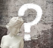 a white marble busturine with question mark on it