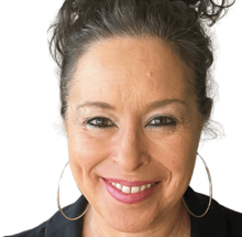 a woman with a large hoop earrings and a black shirt