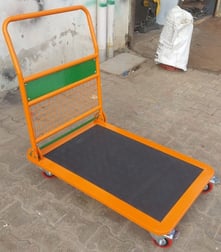 A foldable platform trolley for shifting the material to one place to another place.