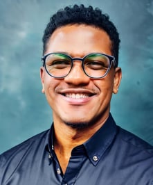 a man with glasses and a black shirt