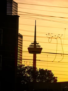 a tower with a tower in the background