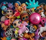 a bunch of dolls dolls and toys on display