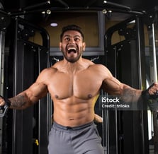 a man performing cable flyes exercise
