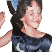 a young girl in a blue dress with a blue hat