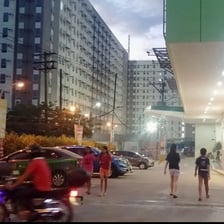 a group of people walking down a street