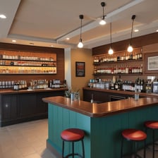 An indoor space under renovation, featuring a bar counter with various construction materials and tools scattered around. The walls are decorated with floral wallpaper. Multiple pendant lights hang from the ceiling, casting a warm glow. A ladder and several cardboard boxes are visible in the background.