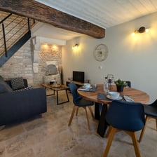 a dining room table with chairs and a couch