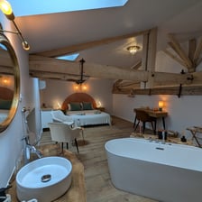 a bathroom with a bathtub and a sink