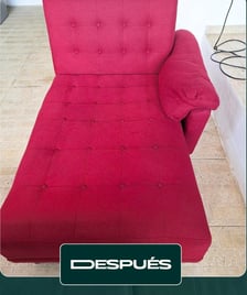 a red couch with a red couch and a black chair