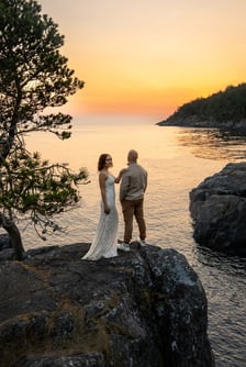 Couple eloping on the side of a cliff in Ucluelet