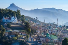 Beautiful houses in the mountain ranges covering with mist