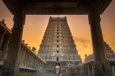 A temple shrine with sky background with golden color and sun rising color