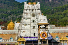 A temple shrine with white and golden color paint