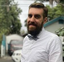 a man with a beard and a bow tie