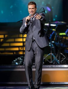 Scott Keo pointing to hi audience, at his World Renown Michael Buble' Tribute Artist Singer Show